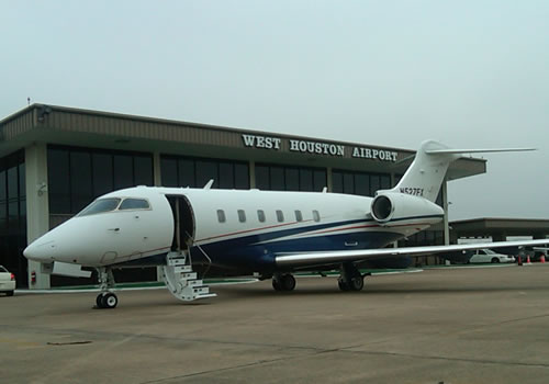 Lare airplane in front of West Houston Airport in Houston, Texas